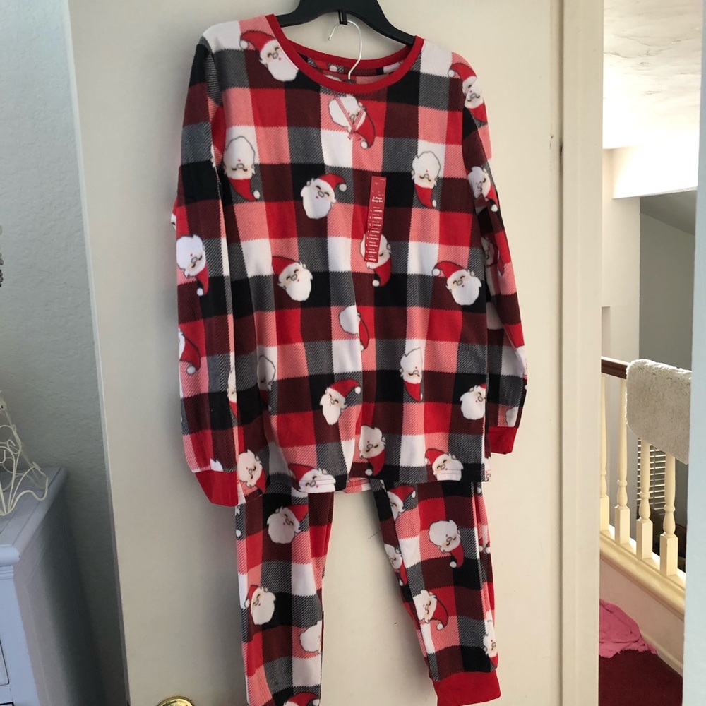 Two Piece Christmas sleepwear. Brand new with tags. Red, white and black. Size L